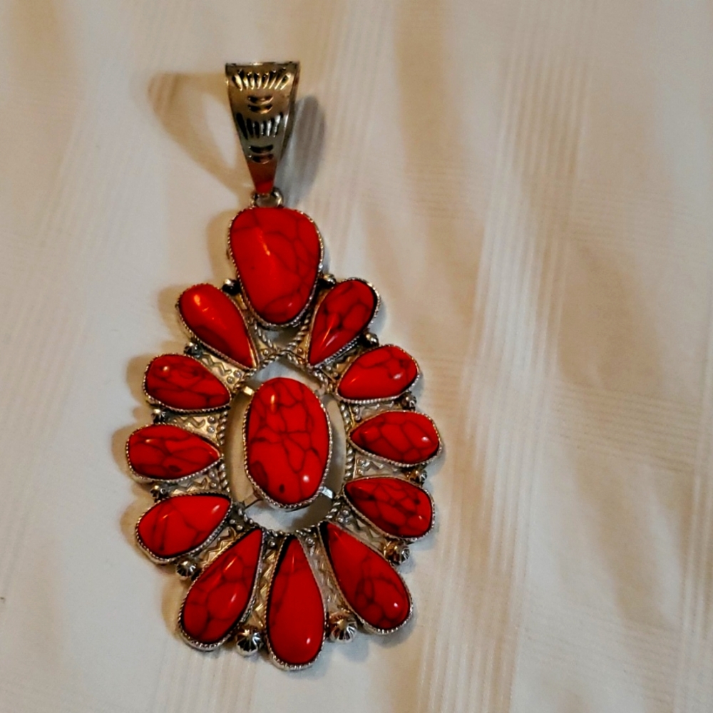 Faux coral and silver tone pendant